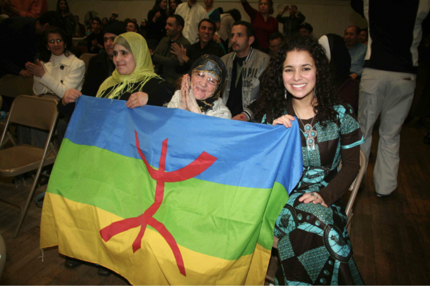 Amazigh flag being held by three generations of Amazigh women in Everett, MA, 2010 (photo: © Cynthia Becker)